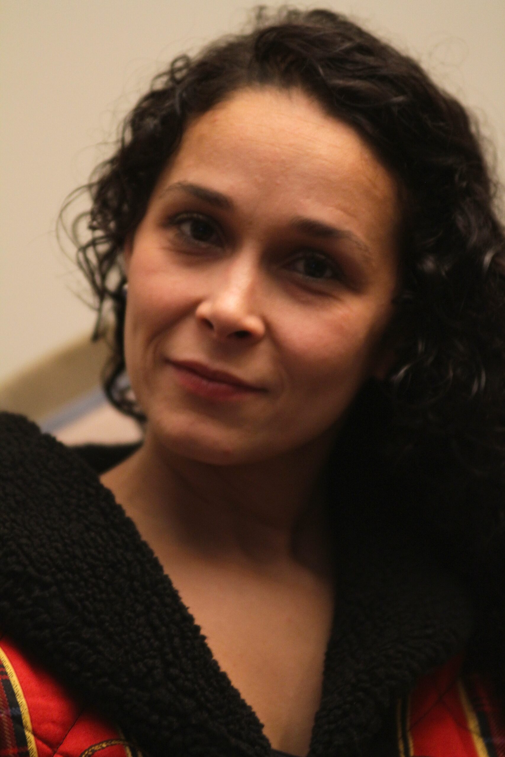 Close-up portrait of woman with curly hair